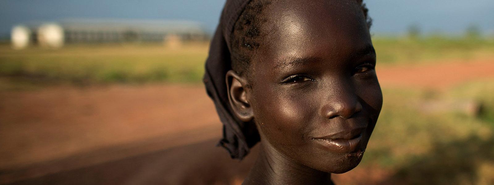 a young girl in smiling for the camera