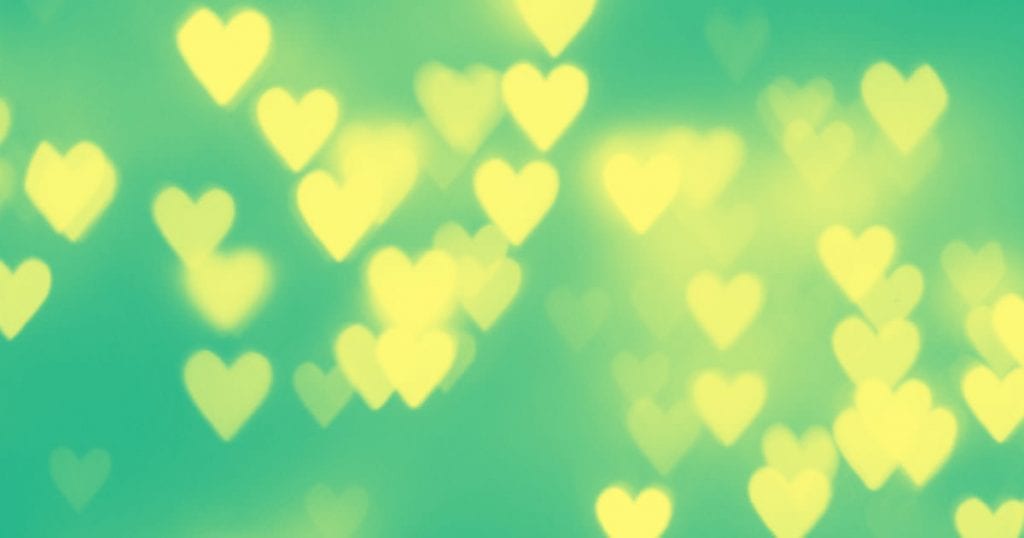 bokeh hearts on a green background